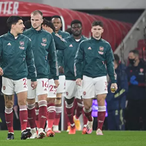 Arsenal Players Hector Bellerin, Rob Holding, and Kieran Tierney Prepare for Arsenal v Aston Villa in Empty Emirates Stadium (2020-21)