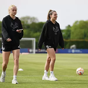 Arsenal Players Kathrine Kuhl and Gio Queiroz Inspecting the Pitch Before Everton vs Arsenal Women's Super League Match