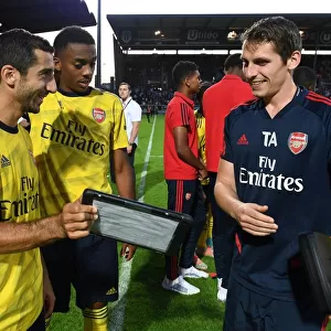 Arsenal Players Mkhitaryan and Willock Review Match Stats with Sports Scientist Allen