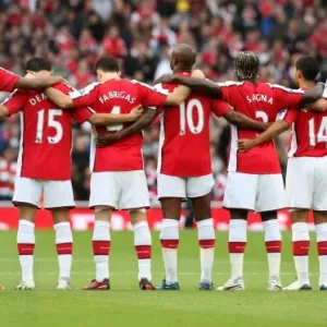 The Arsenal players observe a minutes silence for Remembrance Sunday