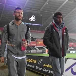 Arsenal Players Shkodran Mustafi and Alex Iwobi Arrive at Swansea City Stadium before Premier League Match, 2018 Arsenal Players Shkodran Mustafi and Alex Iwobi Arrive at Swansea City Stadium before Premier League Match, 2018