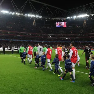 The Arsenal players walk out onto the pitch before the match. Arsenal 3: 0 AC Milan