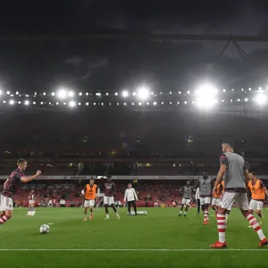 Arsenal Players Warm Up Ahead of Carabao Cup Clash Against AFC Wimbledon