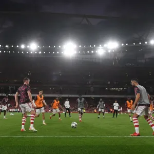 Arsenal Players Warm Up Ahead of Carabao Cup Clash vs. AFC Wimbledon