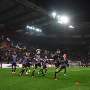 Arsenal Players Warm Up Ahead of Olympiacos Clash in Europa League Arsenal Players Warm Up Ahead of Olympiacos Clash in Europa League