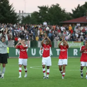 The Arsenal players wave to the fans after the match The Arsenal players wave to the fans after the match