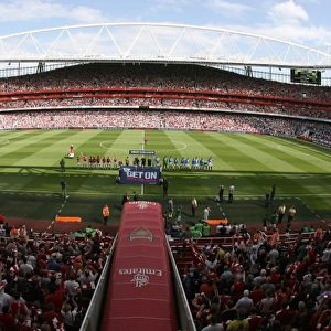 The Arsenal and Portsmouth Teams line up before the match