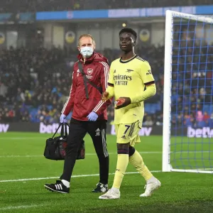 Arsenal Print: Jordan Reece Tends to Bukayo Saka Arsenal Print: Jordan Reece Tends to Bukayo Saka