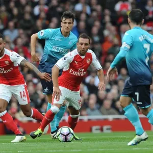 Arsenal Rivals Clash: Walcott vs Cazorla in Intense Premier League Battle
