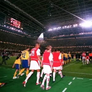 The Arsenal and Southampton teams walk out onto the pitch The Arsenal and Southampton teams walk out onto the pitch