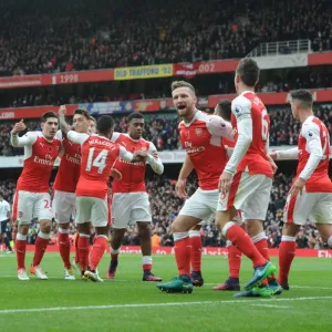 Arsenal Stars: Celebrating a Goal Against Tottenham in the Intense 2016-17 Premier League Clash
