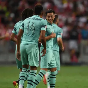 Arsenal Stars Ozil and Aubameyang Celebrate Goal Against Paris Saint-Germain, 2018