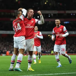 Arsenal Stars: Walcott and Podolski Celebrate First Goal Against Newcastle United (2012-13)