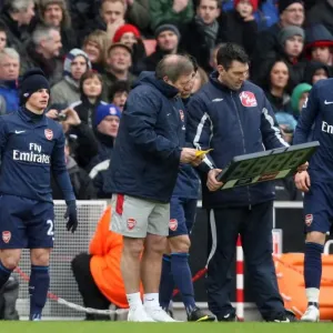 The Arsenal subs wait to come on. Andrey Arshavin (with hat), Eduardo and Aaron Ramsey The Arsenal subs wait to come on. Andrey Arshavin (with hat), Eduardo and Aaron Ramsey