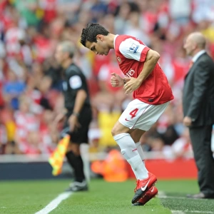 Arsenal substitute Cesc Fabregas warms up. Arsenal 6: 0 Blackpool, Barclays Premier League