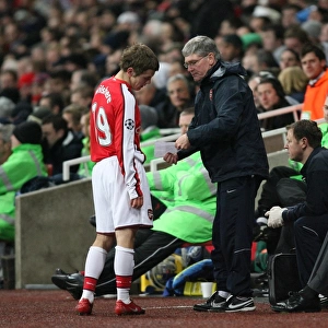 Arsenal substitute Jack Wilshere talks with assistant
