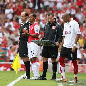 Arsenal substitute Theo Walcott waits to come on