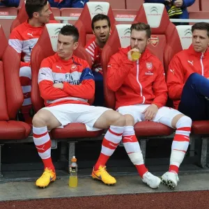 Arsenal Substitutes: Koscielny, Ramsey, Szczesny - Ready on the Sidelines at Arsenal v West Bromwich Albion (2014/15) Arsenal Substitutes: Koscielny, Ramsey, Szczesny - Ready on the Sidelines at Arsenal v West Bromwich Albion (2014/15)