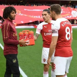 Arsenal Team Camaraderie: Elneny Supplies Drinks to Ramsey and Bellerin Before Arsenal v Everton Match