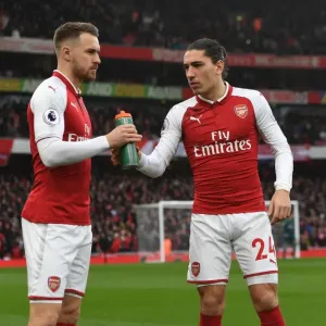 Arsenal Team Camaraderie: Ramsey Supports Bellerin with Gatorade at Arsenal v Tottenham (2017-18)