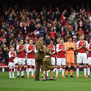 The Arsenal team clap the soldiers with the rememberance reef before the match. Arsenal 2