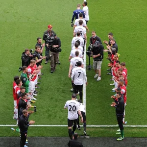 The Arsenal team form a guard of honour for Premier League Champions Manchester United