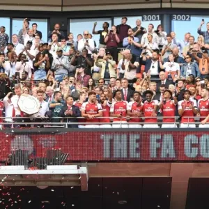 The Arsenal team lift the Community Sheild The Arsenal team lift the Community Sheild