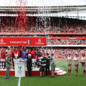 The Arsenal team lift the Emirates Cup Trophy