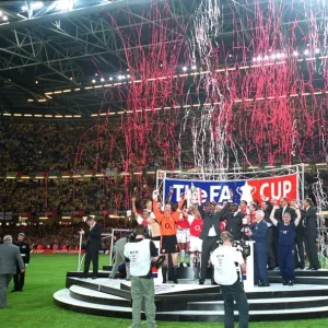 The Arsenal team lift the FA Cup The Arsenal team lift the FA Cup