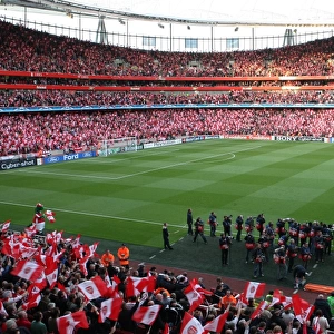 The Arsenal team line ups before the match as the fans