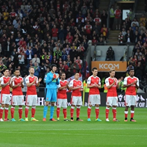 The Arsenal team take part in a minutes applause for a former Hull youth team player