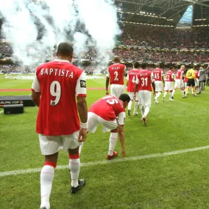 The Arsenal team walk out for the match