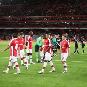 The Arsenal team walk out onto the pitch before the match The Arsenal team walk out onto the pitch before the match