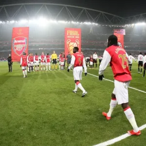 The Arsenal team walk onto the pitch before the match The Arsenal team walk onto the pitch before the match