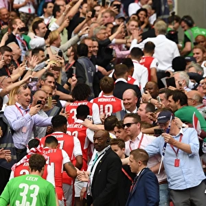 The Arsenal team walk up the wembley steps