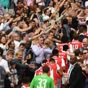 The Arsenal team walk up the wembley steps The Arsenal team walk up the wembley steps