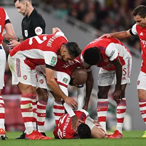 Arsenal Tend to Their Injured Star: Martinelli Attended by Lacazette, Mari, and Partey vs AFC Wimbledon (2021-22 Carabao Cup)