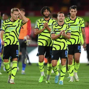 Arsenal Triumph in Carabao Cup Clash against Brentford: Odegaard, Elneny, and Soares Celebrate