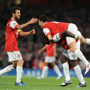 Arsenal Triumph: Nasri, Fabregas, and Eboue Celebrate Double Team Goal vs. Shakhtar Donetsk (5-1), UEFA Champions League, Emirates Stadium
