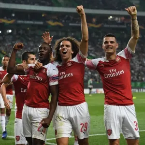 Arsenal Triumph: Welbeck, Guendouzi, and Xhaka Celebrate Goal in Europa League Clash vs Sporting Lisbon (2018-19) Arsenal Triumph: Welbeck, Guendouzi, and Xhaka Celebrate Goal in Europa League Clash vs Sporting Lisbon (2018-19)