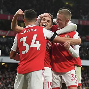 Arsenal Triumph: Xhaka, Zinchenko, and Trossard Celebrate Goal Against Brentford (2022-23)