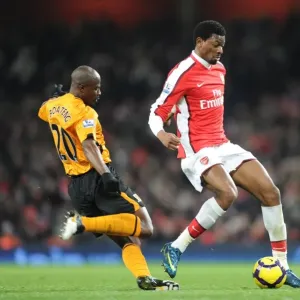 Arsenal Triumphs Over Hull City: Abou Diaby and George Boateng in Action during Arsenal's 3-0 Victory at Emirates Stadium, Premier League 2009-10