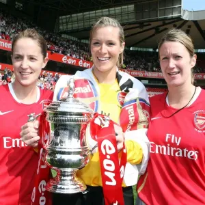 Arsenal Triumphs: Yvonne Tracy, Emma Byrne, and Ciara Grant with the FA Cup after a 4:1 Victory over Leeds United