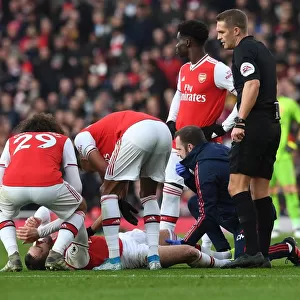 Arsenal v Chelsea: Calum Chambers Receives Treatment from Physio during Intense Premier League Clash