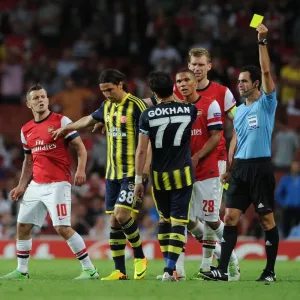 Arsenal v Fenerbahce: Wilshere Fouls Gonul - UEFA Champions League Play-offs Clash