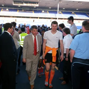 Arsenal Vice Chairman David dein and Jens Lehmann walk up the tunnell at the end of the match