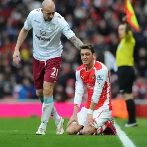 Arsenal vs Aston Villa: Mesut Ozil Fouled by Alan Hutton during the 2014-15 Premier League Match