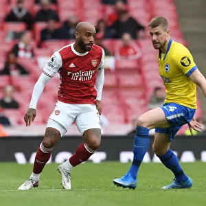 Arsenal vs Brighton: Lacazette Evades Defender Amidst Premier League Tussle (2020-21)