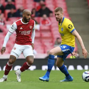 Arsenal vs Brighton: Lacazette Evades Defender Amidst Premier League Tussle (2020-21) Arsenal vs Brighton: Lacazette Evades Defender Amidst Premier League Tussle (2020-21)