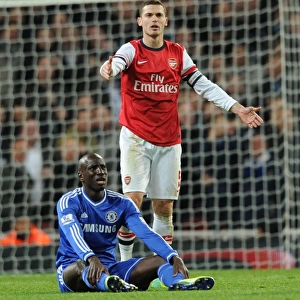 Arsenal vs. Chelsea: Vermaelen Stares Down Ba in Capital One Cup Clash